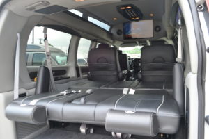 Rear Power Sofa that makes into a Bed or lays flat for Extra Cargo room Explorer Van Company