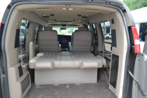 Rear Power Sofa that makes into a Bed or lays flat for Extra Cargo room Explorer Van Company