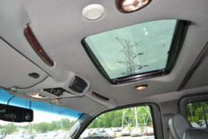 Power Rear Sunroof with Closed Sunshade & Open Rear Storage Cabinet. Explorer Van